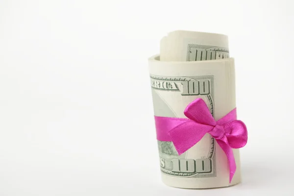 US dollar wrapped by purple ribbon Stock Image