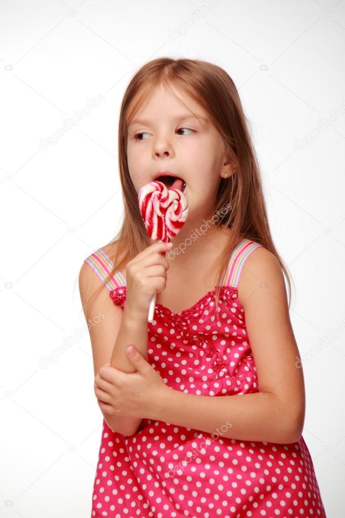 Little girl with lollipop — Stock Photo © Mari1Photo 17840457