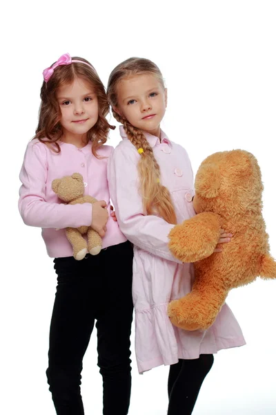 Two girls playing with bear — Stock Photo, Image