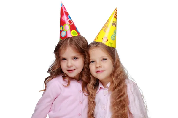 Party girls blowing noisemakers — Stock Photo, Image