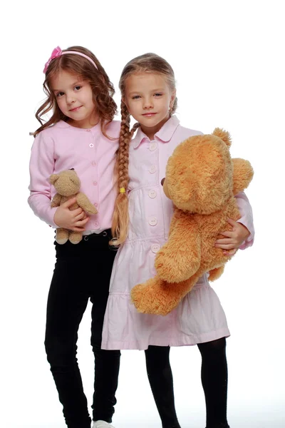 Two girls playing with bear — Stock Photo, Image