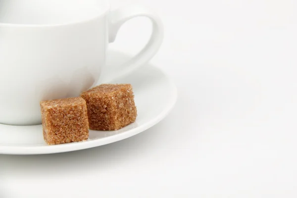 Cup and brown cane sugar — Stock Photo, Image