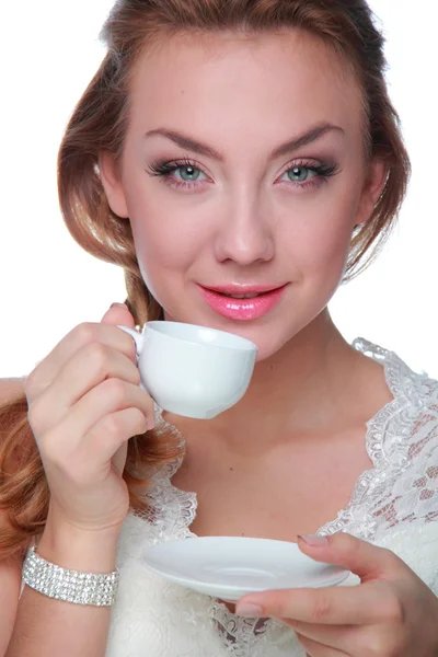 Woman drinking from a cup of coffee — Stock Photo, Image