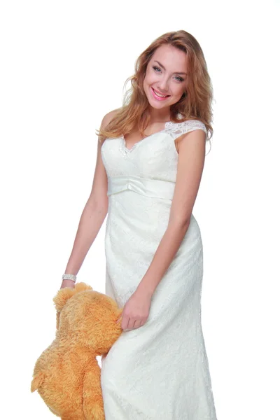 Hermosa mujer con un oso de peluche — Foto de Stock