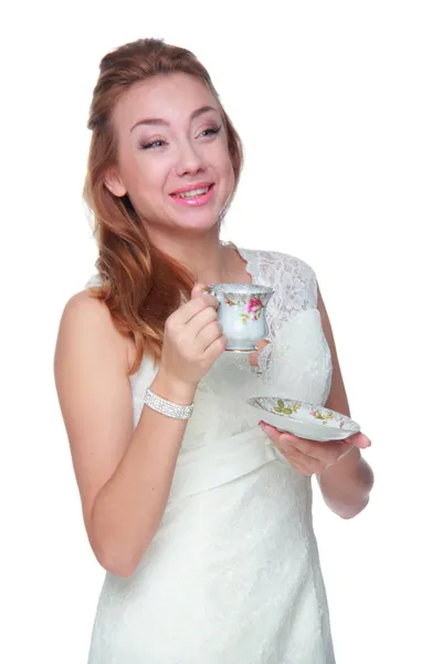 Woman drinking from a cup of coffee — Stock Photo, Image