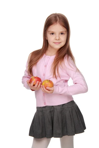 Küçük kız tutan iki elma — Stok fotoğraf