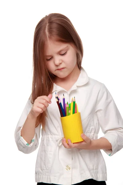 Little schoolgirl with pencils — Stock Photo, Image