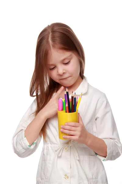 Little schoolgirl with pencils — Stock Photo, Image