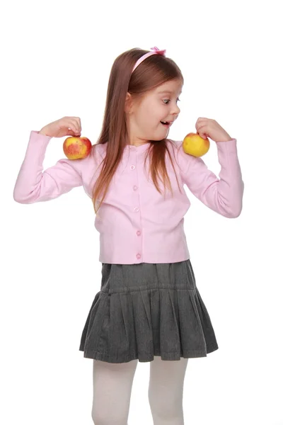 Küçük kız tutan iki elma — Stok fotoğraf