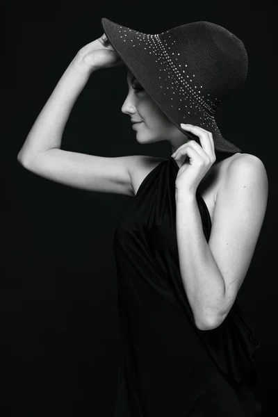 Black-and-white portrait of a beautiful girl in a hat Royalty Free Stock Photos