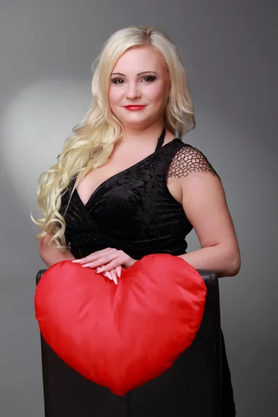 Attractive woman with big red heart — Stock Photo, Image