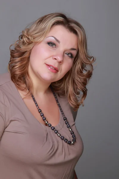 Portrait of a woman with a beautiful necklace — Stock Photo, Image