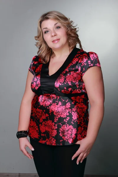 Woman in a floral blouse — Stock Photo, Image