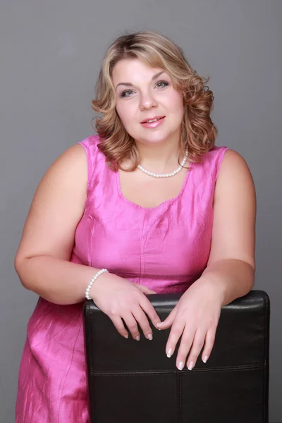 Beautiful woman in a pink dress — Stock Photo, Image