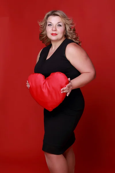 Woman with symbol of heart — Stock Photo, Image