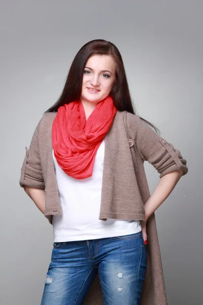 Beautiful girl with a red scarf — Stock Photo, Image