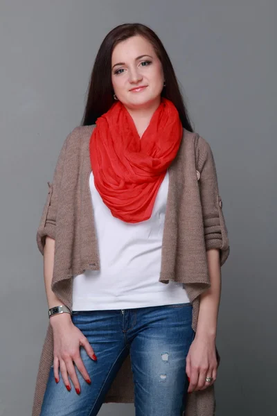 Beautiful girl with a red scarf — Stock Photo, Image