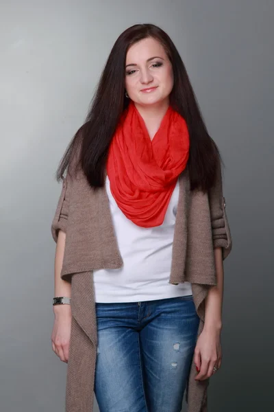 Beautiful girl with a red scarf — Stock Photo, Image