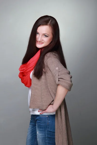 Beautiful girl with a red scarf — Stock Photo, Image