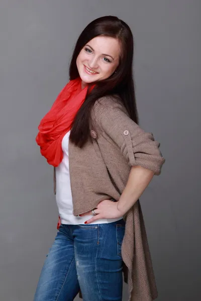 Beautiful girl with a red scarf — Stock Photo, Image