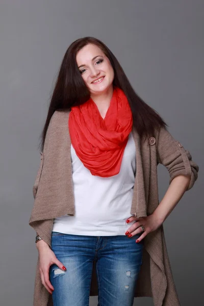 Beautiful girl with a red scarf — Stock Photo, Image