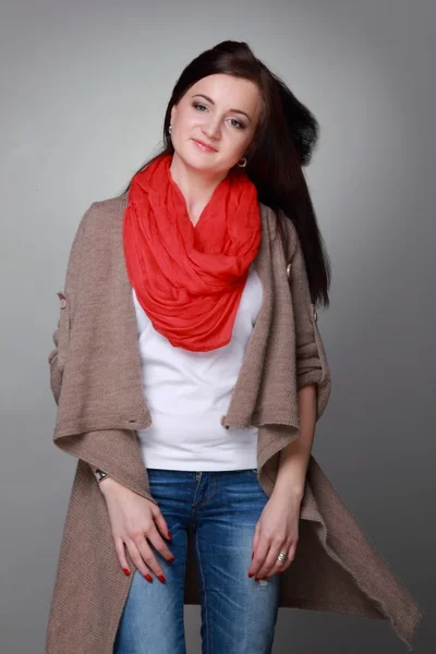 Beautiful girl with a red scarf — Stock Photo, Image
