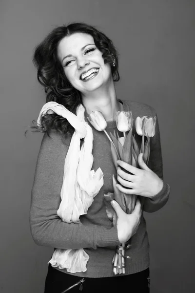 Black-and-white portrait of a girl with tulips — Stock Photo, Image