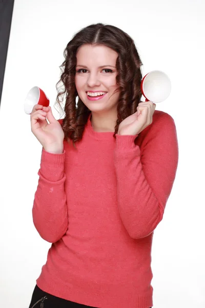 Beautiful girl with a red cups — Stock Photo, Image