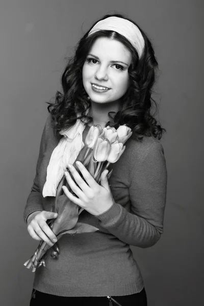 Black and white portrait of a girl with tulips — Stock Photo, Image