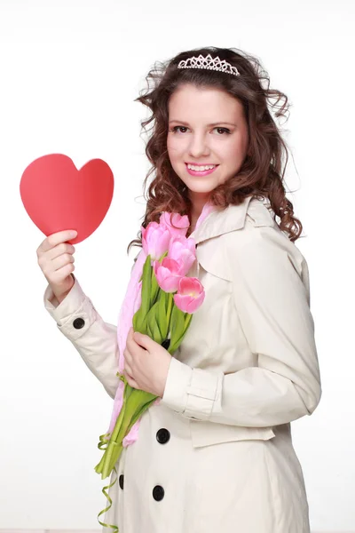 Girl with symbol of heart and tulips — Stock Photo, Image