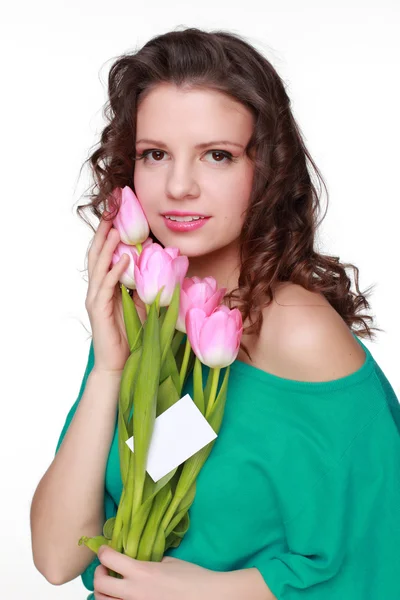 Menina bonita com tulipas e cartão de visita — Fotografia de Stock