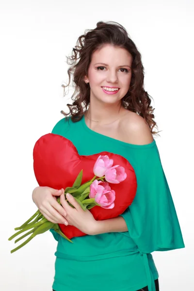 Dívka s symbolem srdce a tulipány — Stock fotografie