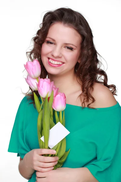 Menina bonita com tulipas e cartão de visita — Fotografia de Stock