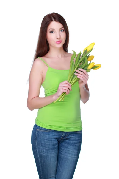Šťastná dívka s žluté tulipány — Stock fotografie