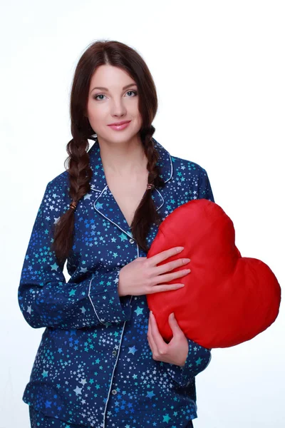 Chica con almohada en forma de corazón — Foto de Stock