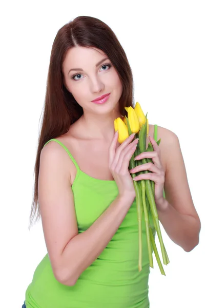 Happy girl with yellow tulips — Stock Photo, Image