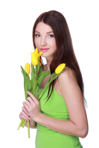 Счастливая девушка с желтыми тюльпанами — стоковое фото