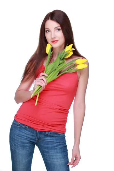 Happy girl with yellow tulips — Stock Photo, Image