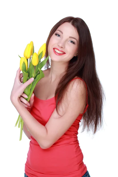 Šťastná dívka s žluté tulipány — Stock fotografie