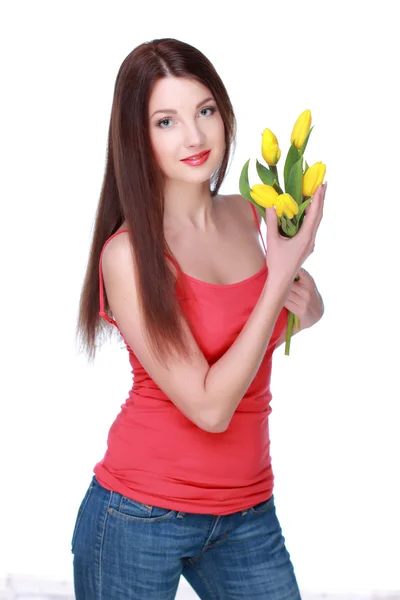 Happy girl with yellow tulips — Stock Photo, Image