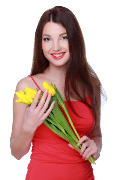 Gelukkig meisje met gele tulpen — Stockfoto