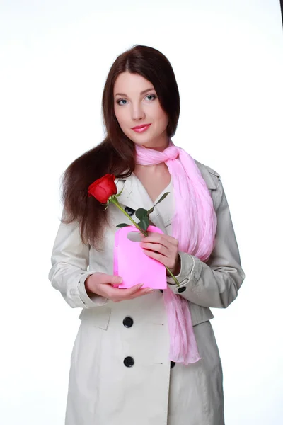 Girl with a rose and gift — Stock Photo, Image