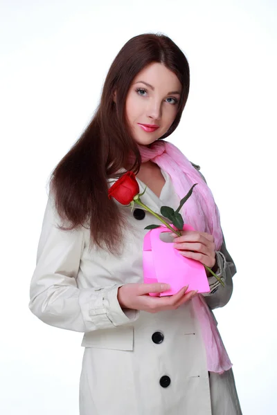 Girl with a rose and gift — Stock Photo, Image
