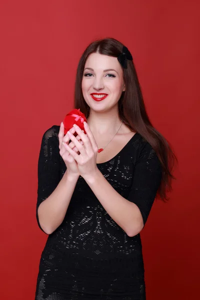 Woman holding a present — Stock Photo, Image