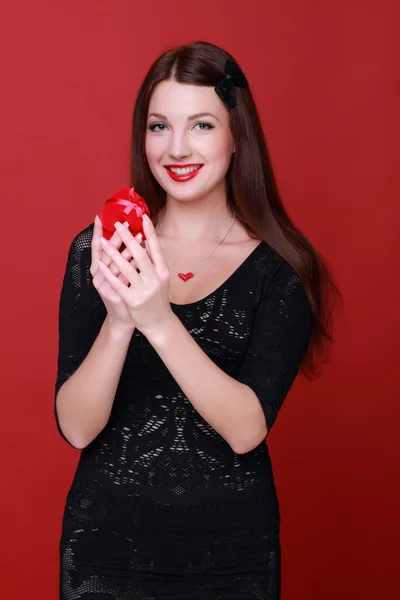 Woman holding a present — Stock Photo, Image