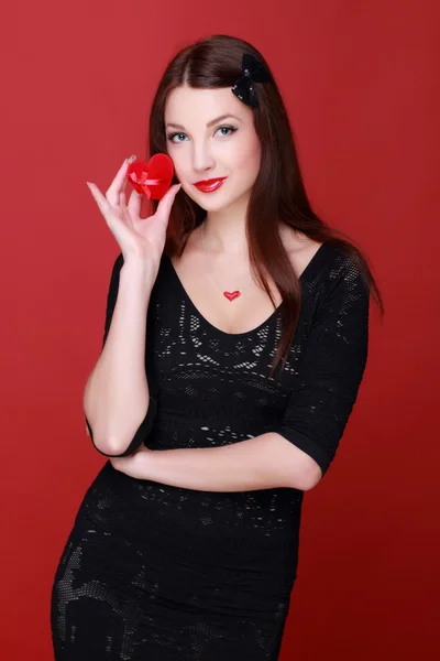 Woman holding a present — Stock Photo, Image