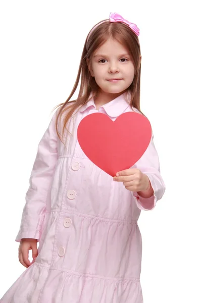 Ung flicka med hjärta på st.valentine holiday tema — Stockfoto