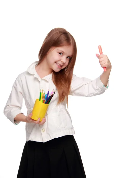 Little schoolgirl with pencils — Stock Photo, Image