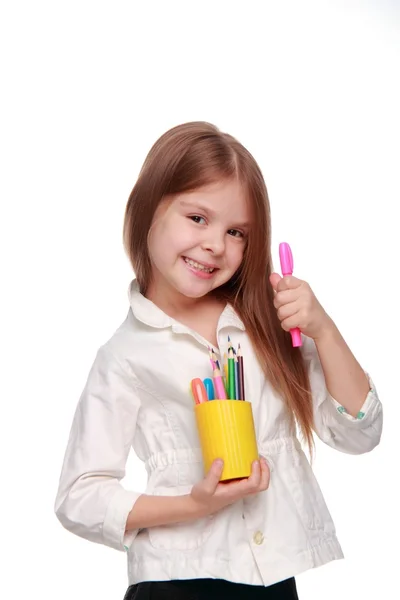 Young girl with lots of pencils smiling happily — Stock Photo, Image