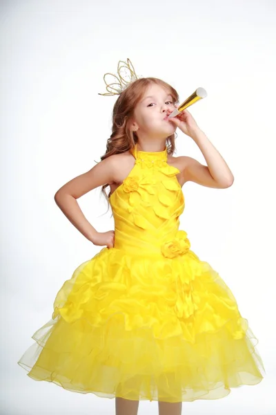 Little girl in a yellow dress and a crown — Stock Photo, Image